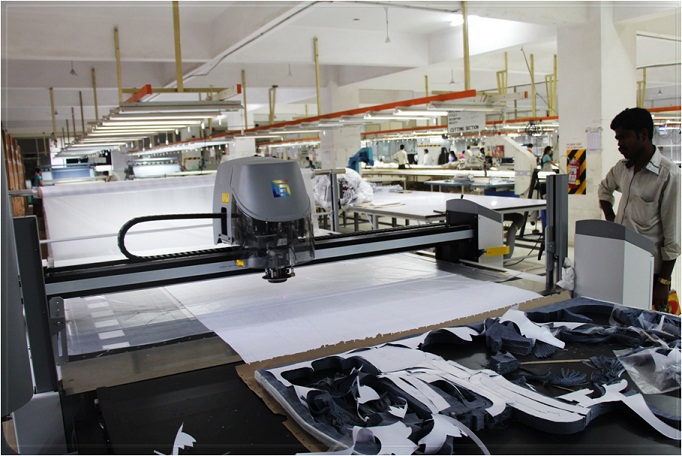 GERBER CUTTER:- The XLC 7000 automatic cutter cuts a variety of materials upto two </br> metres wide at compressed fabric heights upto 7.2cm. The machines knife intelligence <br/>senses deflection of the knife caused  by cutting difficult materials or high ply spreads <br/> and compensates for this deflection.  This results in more accurately cut parts and <br/>makes it possible to nest parts closer together to achieve outstanding material <br/> utilisation.  It has an intelligent & highly  efficient variable vaccum control that regulates <br/>vaccum power thus saving energy.  The machine runs on rails to move along multiple <br/>spreading tables to optimise its usage.